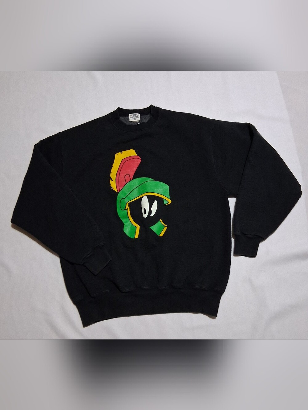 ACME Black Crewneck Sweater with Green Marvin Helmet and Yellow-Red Plume
